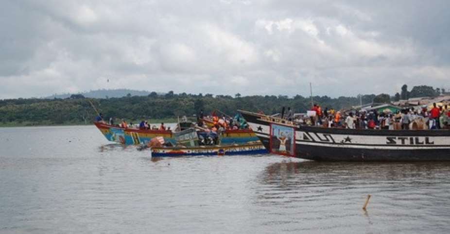 Some canoes about to ferry people on the Volta Lake