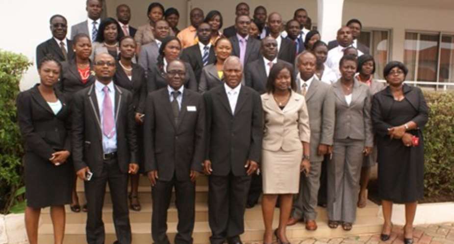 Mr. Gabriel Glover(middle) poses with participants in Kumasi