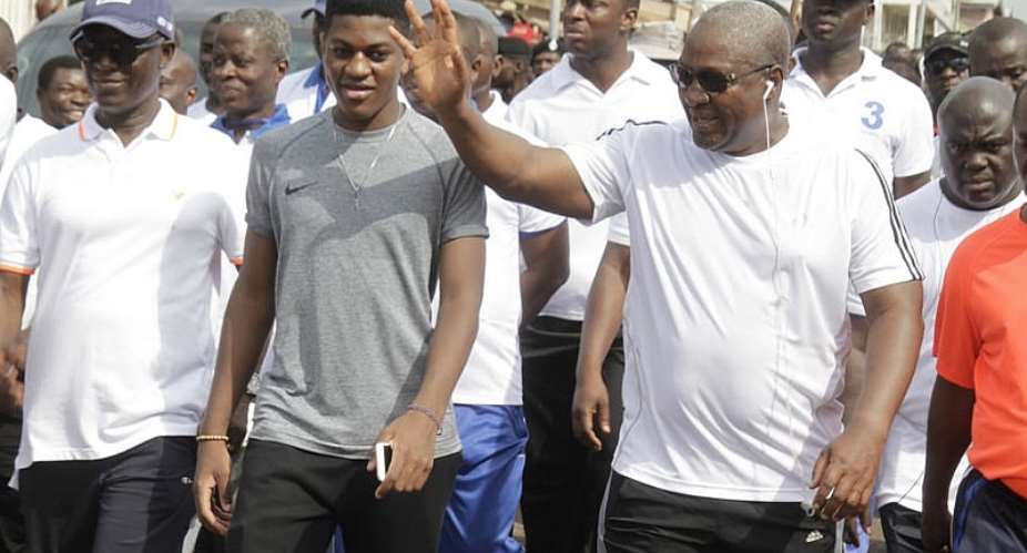 Ghana President John Mahama with his son Sharaf on fitness exercises in Accra