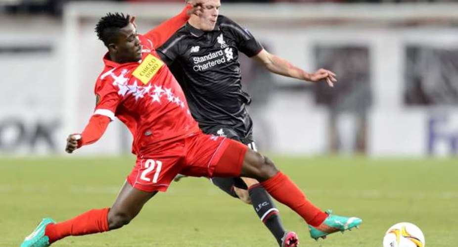 Sion's Ebenezer Assifuah, left, vies for the ball with Liverpool's Bradley Smith, right, during the Europa League group B soccer match between FC Sion and Liverpool