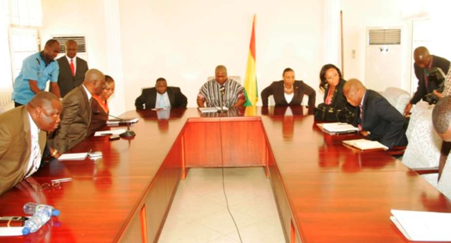 SOME MEMBERS OF THE COMMITTEE THAT INVESTIGATED CAUSES OF THE FRE AND MINISTERS OF STATE AT THE PRESENTATION OF THE REPORT TO VICE PRESIDENT MAHAMA
