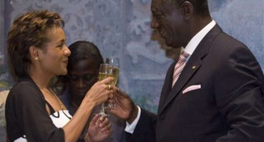 Gov. Gen. of Canada Michaelle Jean, left, shares a toast at a state dinner given in her honor by Ghana President John Agyekum Kufur, right, in Accra, Ghana, Tuesday, Nov. 28, 2006.AP PhotoCP, Fred Chartrand