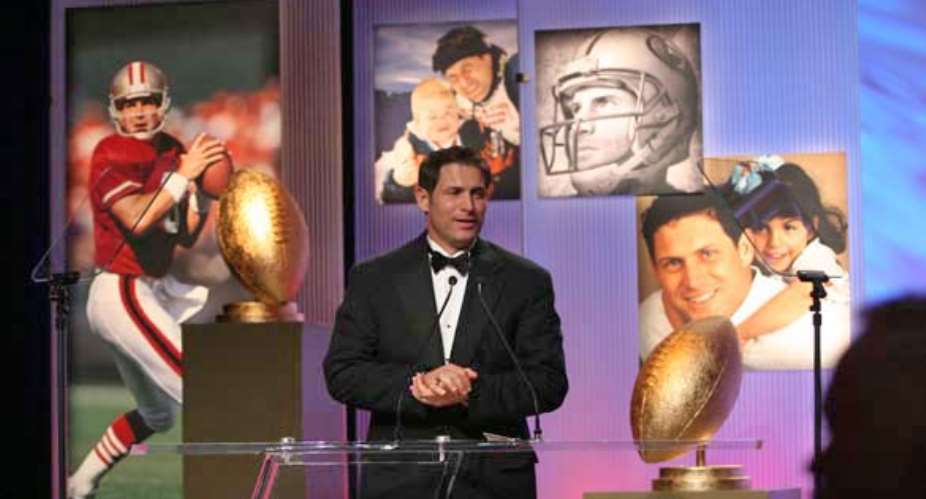 Steve Young is honored by the Utah nonprofit Operation Kids, which raised money for his Forever Young group. Photo, 2005, by Mike Olson, Newman Photography