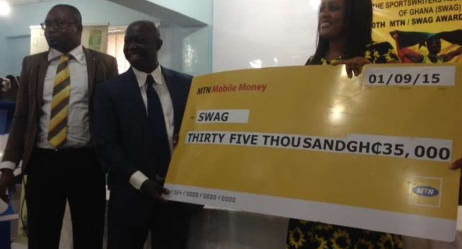 SWAG President Kwabena Yeboah receiving the cash cheque