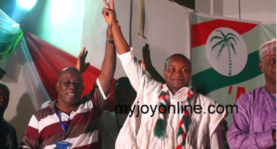 Ebenezer Aggrey-Fynn of the EC declared Hassan Ayariga (middle) winner of the presidential election Saturday.