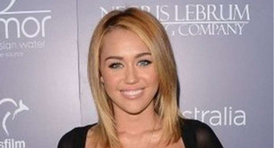 Armed police storm Miley Cyruss house