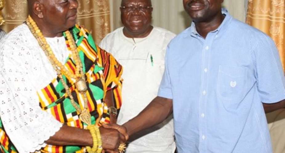 The Awoemefia of Anlo state, Togbui Sri III in a handshake with Mr. Agyepong, looking on are some elders of the Anlo State