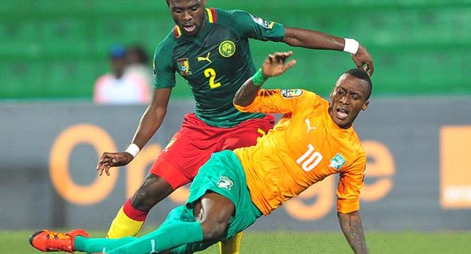 Krahire Yannick Zakri of Ivory Coast is fouled by Joseph Ngwem of Cameroon during the 2016 CHAN Rwanda quarterfinal between Cameroon and Ivory Coast at Huye Stadium, Butare on 30 January 2016 Ryan WilkiskyBackpagePix