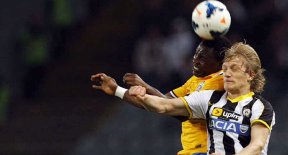 Juventus' Kwadwo Asamoah L jumps for the ball with Udinese's Dusan Basta during their Italian Serie A match on Monday.