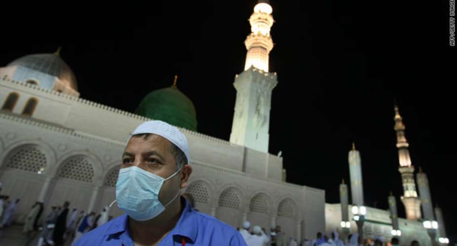 A Muslim pilgrim wears a mask for protection against the swine flu in the holy city of Medina.