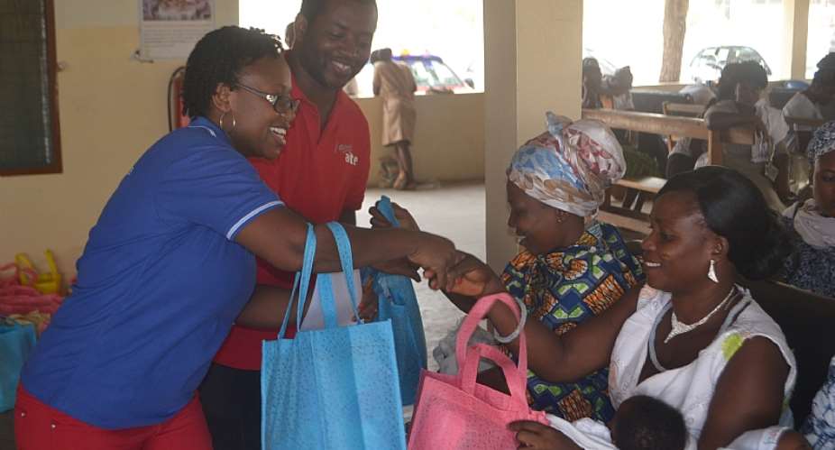 Yaw Ofori Owusu Airtel Employee And Leader Of The Project And Ms. Eleanora Agyei Handing Over The New-Born Arrival Packs To Some Of The Mothers At The Ashaiman Polyclinic