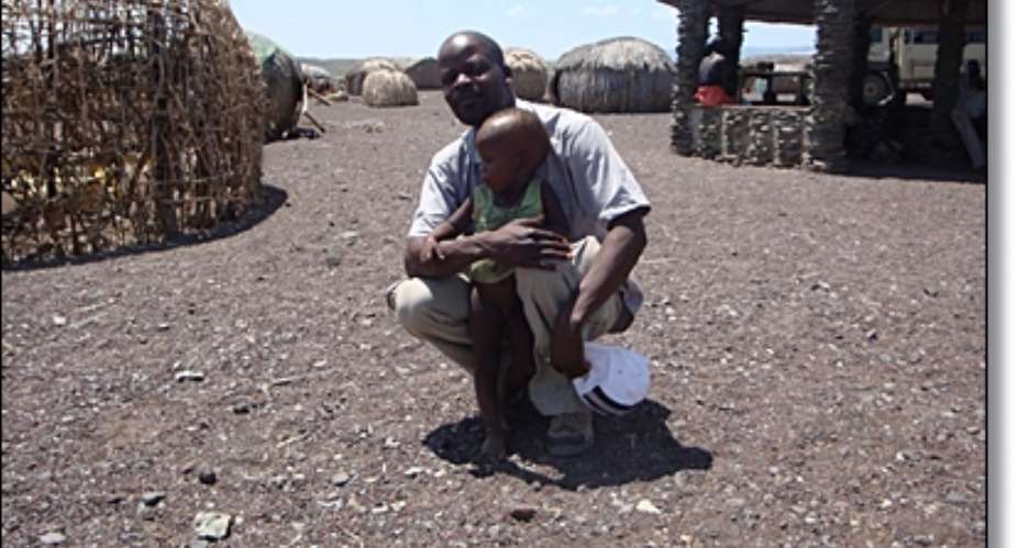 The author with a Turkana child at El Molo village near Lake Turkana.