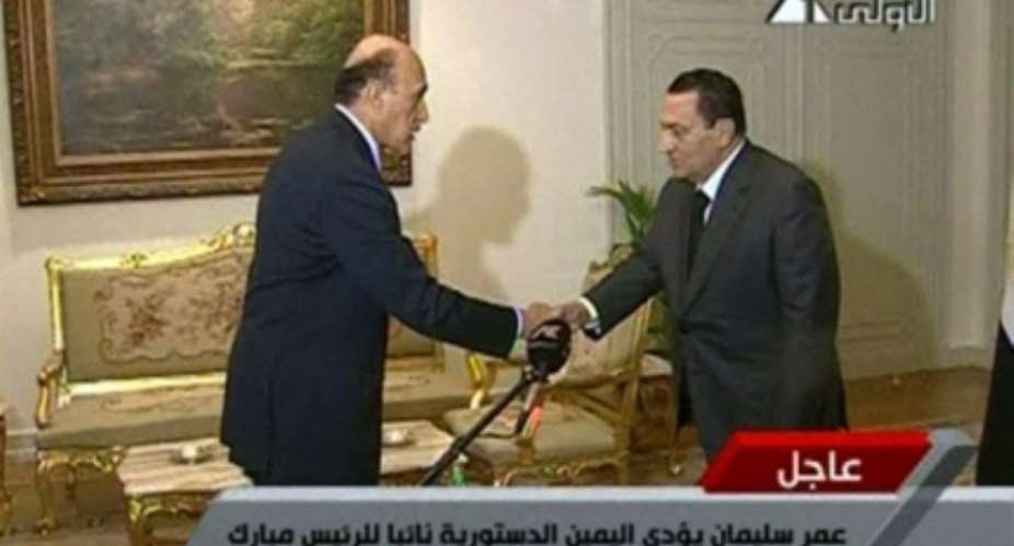 In this image taken from TV, Egyptian President Hosni Mubarak, right, is seen shaking the hand of Omar Suleiman, who is sworn in as Vice President of Egypt, Saturday Jan. 29, 2011. AP  Egypt State TV