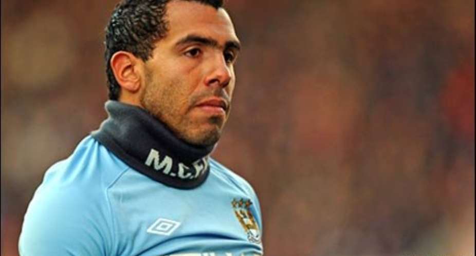 Carlos Tevez would be sued if he lays down his boots