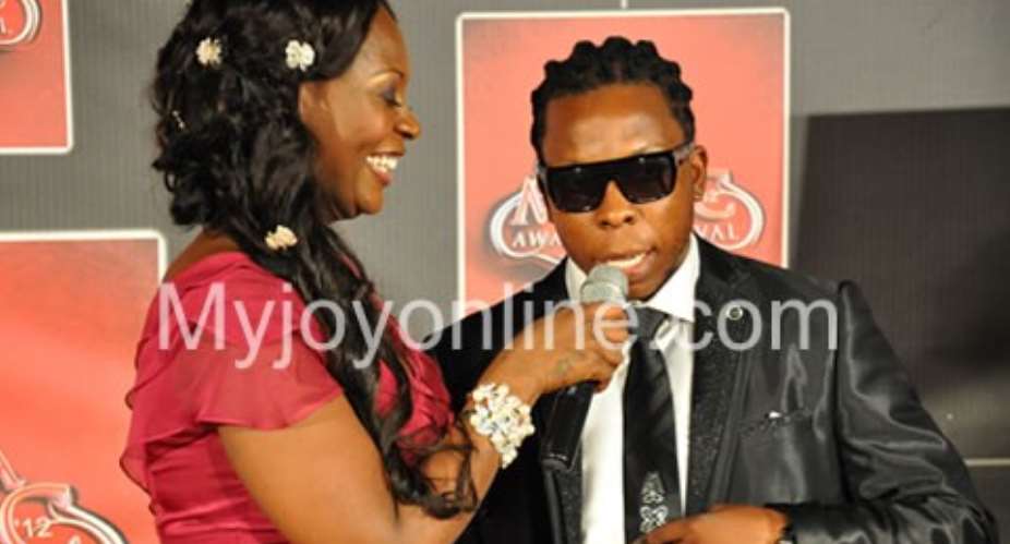 Confidence interviewing Edem on the red carpet
