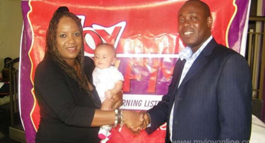 Marketing Manager of Joy FM (right) Max Fuger in a handshake with an official from Volta Catch