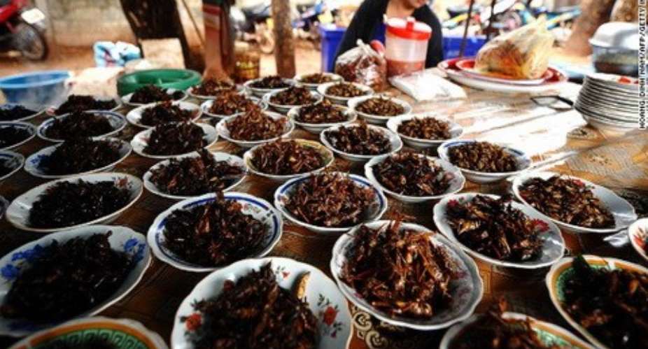 Fried crickets and grasshoppers are sold at markets like this one in Vientiane.
