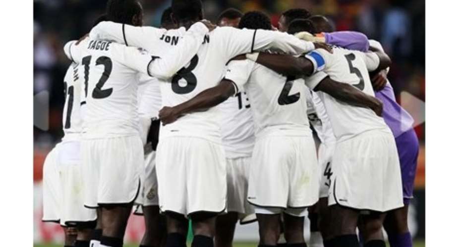 The Black Stars in prayer ahead of a game