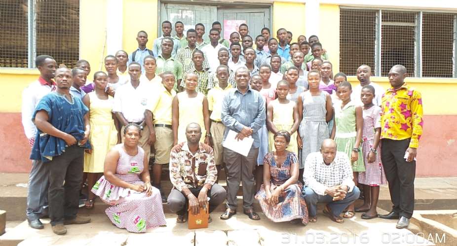Hon. Emmanuel Kwasi Bedzrah and his officers in a group photograph with some beneficiaries and parents