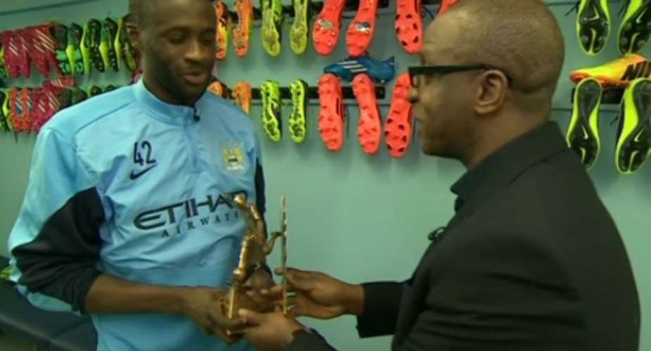 Yaya Toure being presented with the award on Monday
