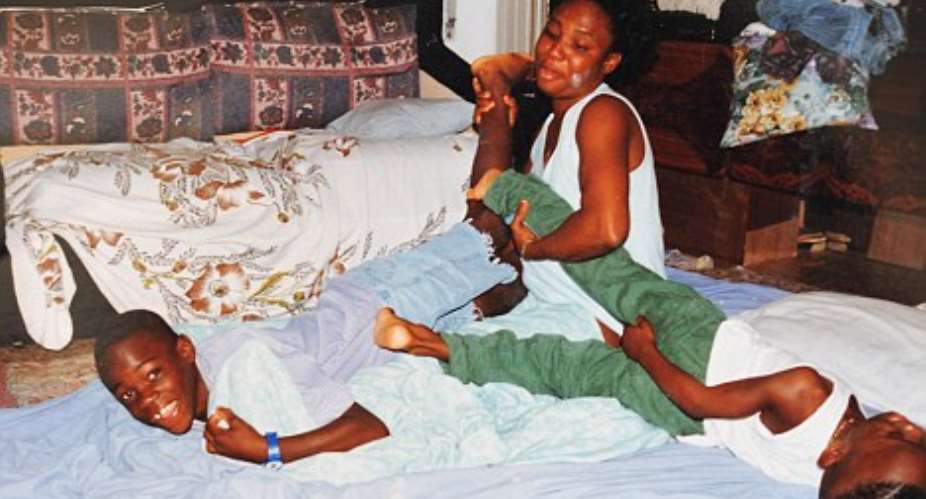 Young Balotelli playing with his biological mother and brother