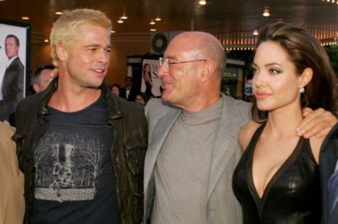 Brad Pitt, producer Arnon Milchan and Angelina Jolie arrive at the premiere of Mr & Mrs Smith in 2005
