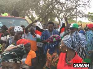 Figure 4 Then Candidate Sumah, mobbed by a crowd at a campaign event
