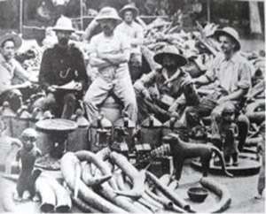 Members of the notorious British Punitive Expedition displaying proudly their loot.