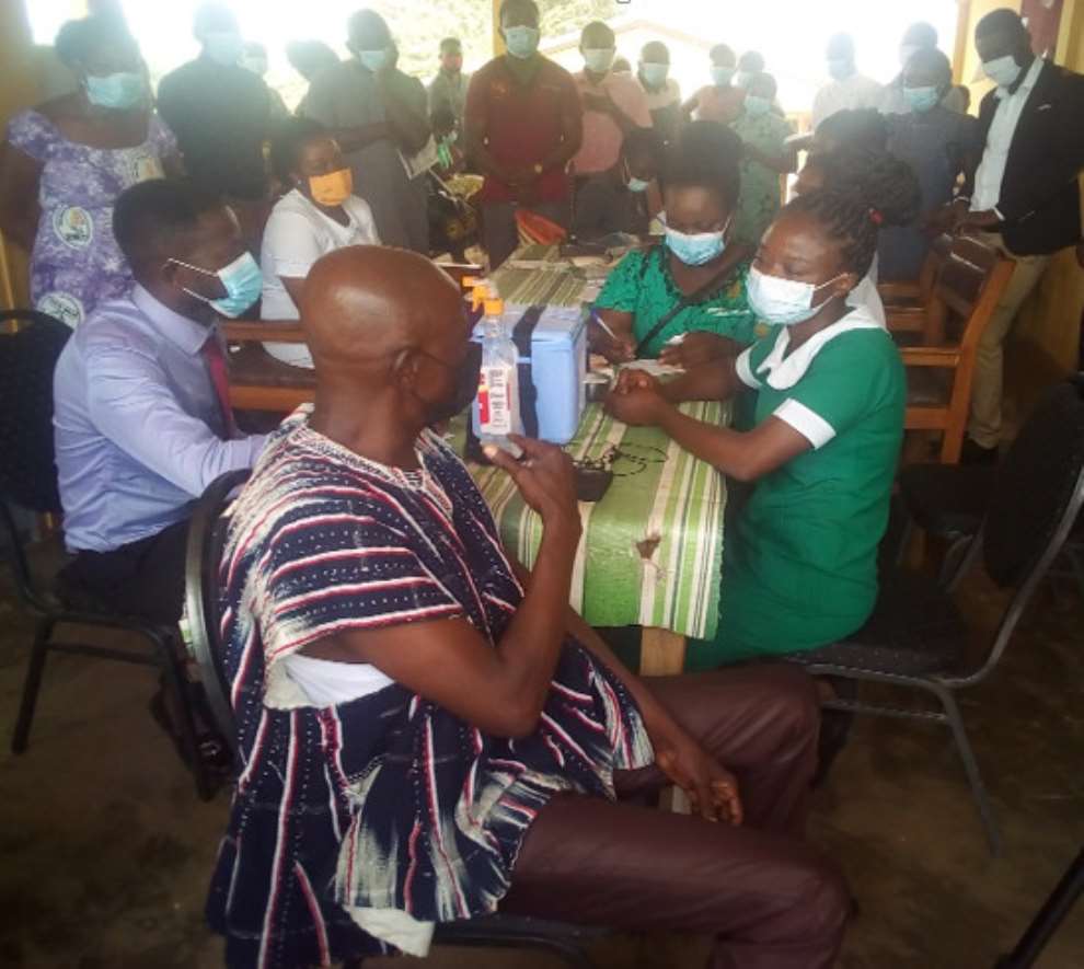 MCE for Berekum, Mr. Kofi Adjei taking the COVID-19 jab