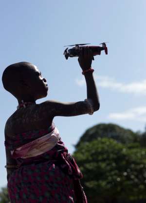 A woman holds a drone in Anyako, Ghana Photo By Seth Ebenezer Tetteh via UnSplash