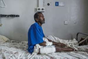 Tamrat Kidanu said he stood still after being shot when he heard Eritrean troops slaughter his son and other men in Dengolat.  By EDUARDO SOTERAS (AFP)