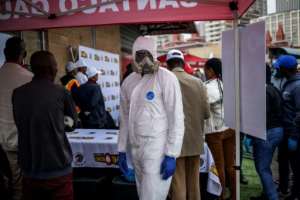 Taxi ranks have deployed cleaners in full protective gear to help with the sanitisation. By Michele Spatari (AFP)