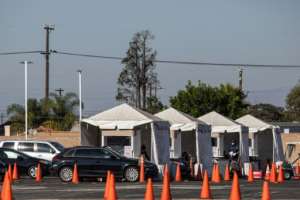 Testing including at drive-in sites has revealed a million new cases in less than a week in the US. By Apu GOMES (AFP)