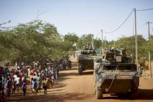 Thousands of protesters held up a French military convoy in several Burkinabe towns as it was transiting the country to reach Niger from Ivory Coast. By MICHELE CATTANI (AFP/File)