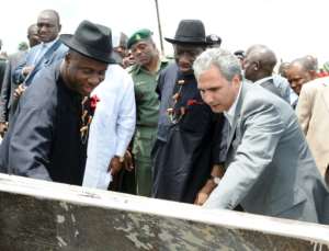 The cousin of former president Goodluck Jonathan (C) won a contract to build an eight-kilometre road that was never completed. By PIUS UTOMI EKPEI (AFP/File)