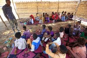 The camp's teachers say they want their makeshift classrooms to provide a place where refugee children can feel safe after the horrors some of them saw back home in Ethiopia. By ASHRAF SHAZLY (AFP)