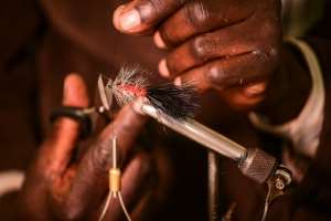 The artificial lures are designed to imitate the particular insects that trout, salmon and other species feast on. By Simon MAINA (AFP)