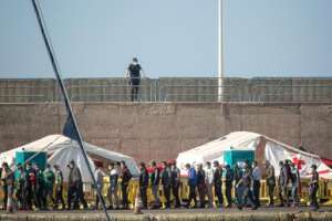 The Arguineguin port camp was put up to process arrivals and run virus tests but it has become saturated with more than 2,000 migrants sleeping there. By DESIREE MARTIN (AFP)