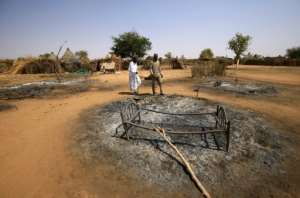 The attack left some of the resident's basic wooden huts completely burnt to the ground.  By ASHRAF SHAZLY (AFP)