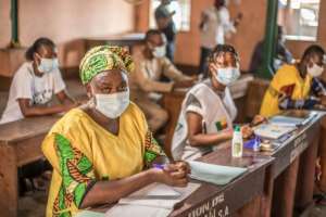 The autonomous national election commission (CENA) made face masks mandatory for voting and enforced social distancing measures at polling stations. By Yanick Folly (AFP)