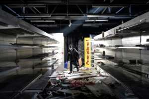 The Auchan supermarket was one of the stores targeted by the looters in Dakar.  By JOHN WESSELS (AFP)