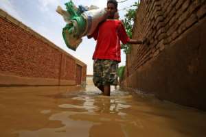 The Blue Nile water levels have risen to the highest since records began a century ago, swamping efforts to stop the river by building barrages of sand bags. By ASHRAF SHAZLY (AFP)