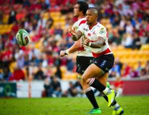 The Golden Lions' Elton Jantjies passes the ball during their Super Rugby match against the Queensland Reds, in Brisbane, on April 28, 2018.  By Patrick HAMILTON (AFP/File)