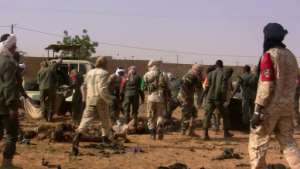The dead and injured are evacuated following a suicide bomb attack that ripped through a camp grouping former rebels and pro-government militia in Gao, in the troubled northern Mali left 50 people dead on January 18, 2017 in Ga