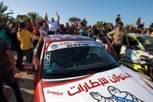 The enthusiastic crowd of mostly young men watched on and took photos as the cars, some with lights flashing or splashed with advertising, sent up clouds of smoke as they skidded and spun. By Abdullah DOMA (AFP)