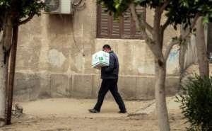 The Egyptian Food Bank is committed to shipping out an initial lot of 500,000 food cartons throughout the country's 27 governorates with around 5,000 charities distributing the parcels. By Mohamed el-Shahed (AFP)