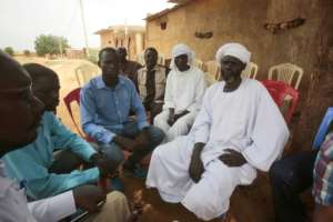 The father of one of the Sudanese schoolchildtren killed at Monday's protest against the shortage of bread and fuel receives condolences in front of the family home in the central city of Al-Obeid. By ASHRAF SHAZLY (AFP)
