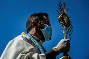 The faithful found creative ways to celebrate Easter Sunday in the age of social distancing. By PATRICIA DE MELO MOREIRA (AFP)