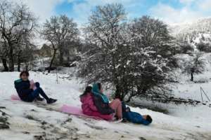 The kids might be enjoying the snow, but their parents say some are of an age when they should be at school. By Sakis MITROLIDIS (AFP)