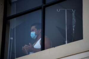 The initiative is a way to express solidarity with patients battling Covid-19 alone, isolated from family and friends in plastic-wrapped hospital wards. By RODGER BOSCH (AFP)